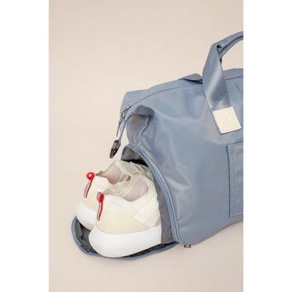 Maleta deportiva para mujer  con manija integrada para colocar en una maleta de equipaje rondate, color azul claro, DCVS